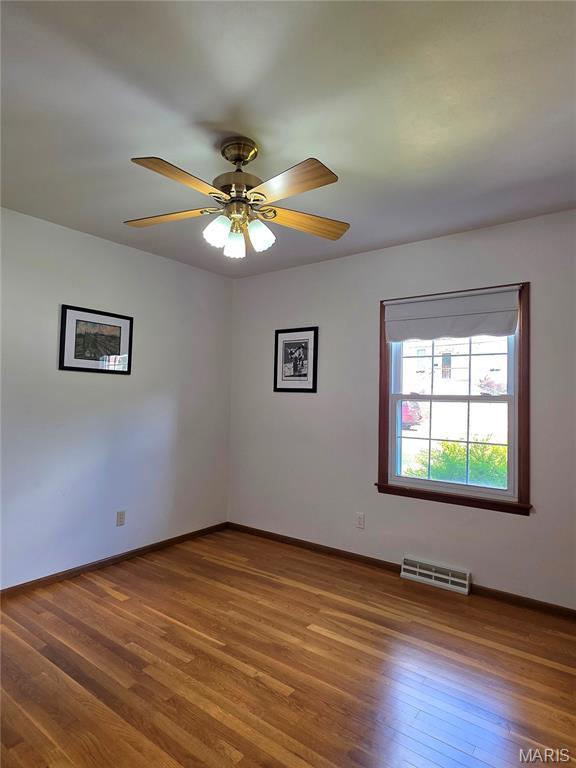 320 W 6th St, Washington, MO 63090 - spare room with wood finished floors and ceiling fan