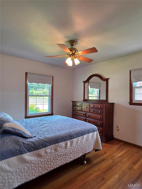 320 W 6th St, Washington, MO 63090 - bedroom with wood finished floors and a ceiling fan