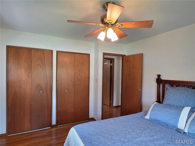 320 W 6th St, Washington, MO 63090 - bedroom with two closets, wood finished floors, and ceiling fan