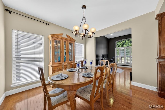 1304 Forest Way, Wentzville, MO 63385 - dining area featuring a chandelier and wood finished floors