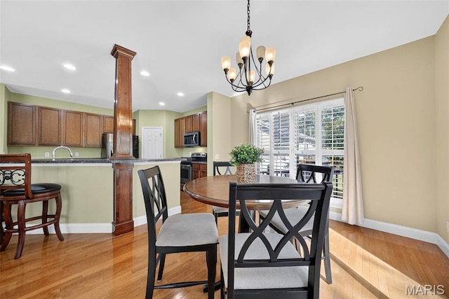 1304 Forest Way, Wentzville, MO 63385 - dining area featuring light wood-type flooring, recessed lighting, and a chandelier