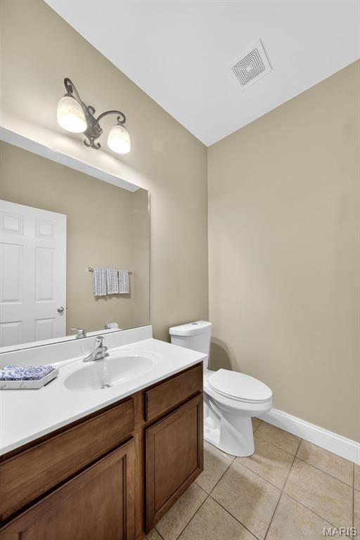 1304 Forest Way, Wentzville, MO 63385 - half bathroom featuring vanity and tile patterned flooring