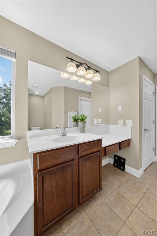 1304 Forest Way, Wentzville, MO 63385 - bathroom with vanity, tile patterned flooring, and a garden tub