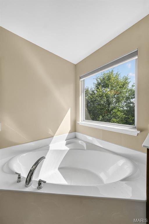 1304 Forest Way, Wentzville, MO 63385 - bathroom featuring a garden tub