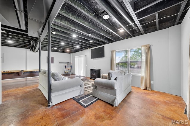 1304 Forest Way, Wentzville, MO 63385 - living room featuring finished concrete flooring and a wood stove