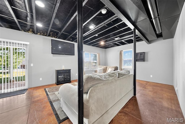 1304 Forest Way, Wentzville, MO 63385 - living area featuring concrete floors and a wall unit AC