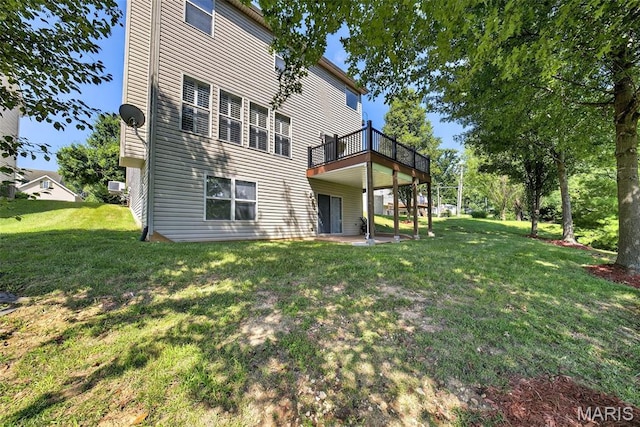 1304 Forest Way, Wentzville, MO 63385 - back of property featuring a lawn, a wooden deck, and a patio
