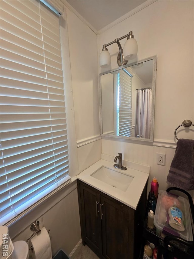 1414 Newton Ave, Johnston City, IL 62951 - full bath with vanity, wainscoting, and crown molding