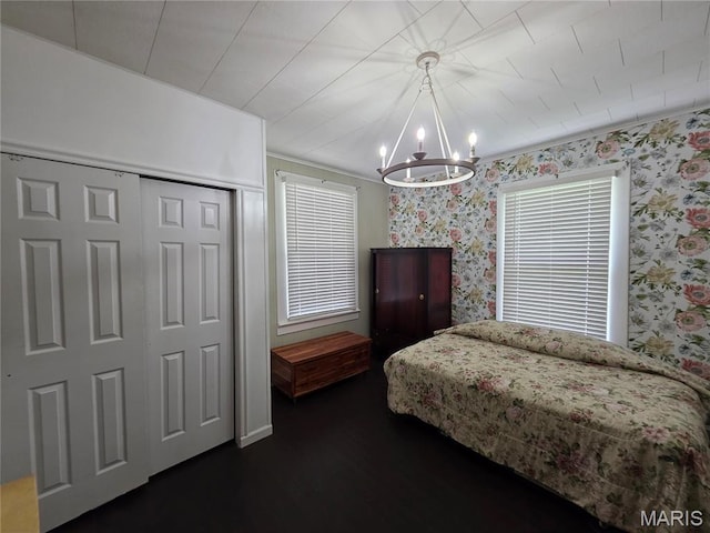 1414 Newton Ave, Johnston City, IL 62951 - bedroom with a chandelier, wallpapered walls, dark wood-style floors, and a closet