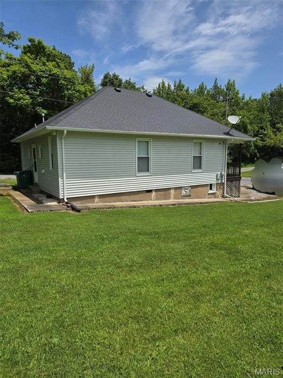 1414 Newton Ave, Johnston City, IL 62951 - rear view of house with a lawn and roof with shingles
