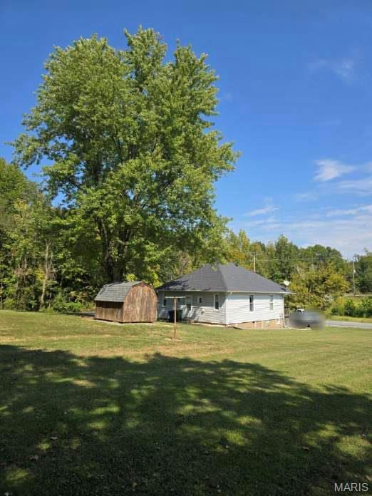 1414 Newton Ave, Johnston City, IL 62951 - view of grassy yard with a storage shed