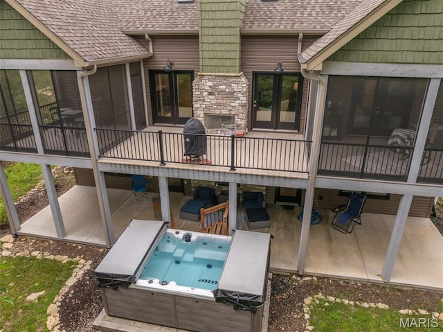 2740 Tyrol View Ct, Innsbrook, MO 63390 - wooden terrace featuring a hot tub, a patio, area for grilling, and french doors