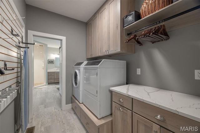 2740 Tyrol View Ct, Innsbrook, MO 63390 - laundry area with washer and dryer and cabinet space