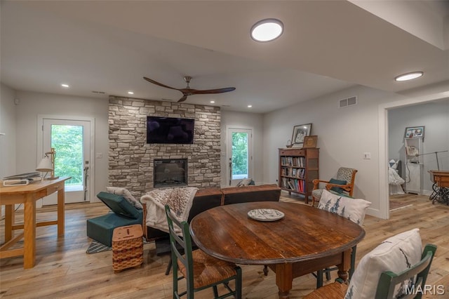 2740 Tyrol View Ct, Innsbrook, MO 63390 - dining area featuring ceiling fan, light wood-style flooring, recessed lighting, and a stone fireplace