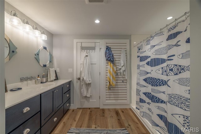2740 Tyrol View Ct, Innsbrook, MO 63390 - bathroom featuring wood finished floors, vanity, recessed lighting, and a shower with curtain