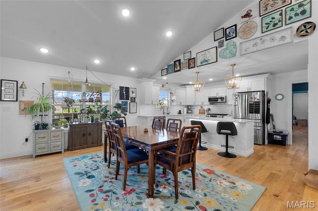 236 Haydens Trl, Jackson, MO 63755 - dining room with vaulted ceiling, light wood-style flooring, recessed lighting, and a chandelier