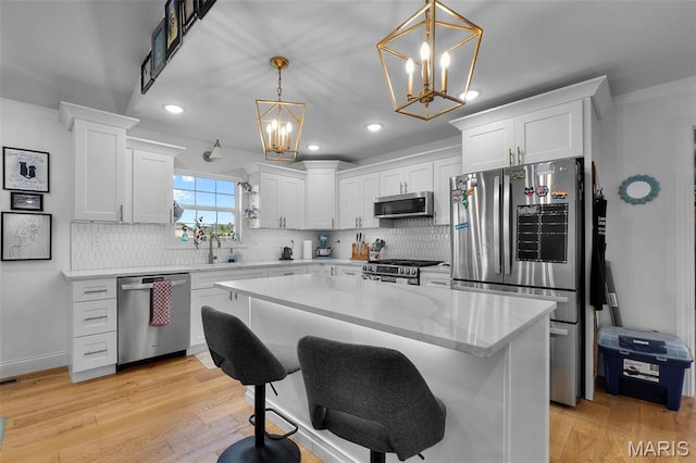 236 Haydens Trl, Jackson, MO 63755 - kitchen with stainless steel appliances, a chandelier, white cabinetry, tasteful backsplash, and recessed lighting