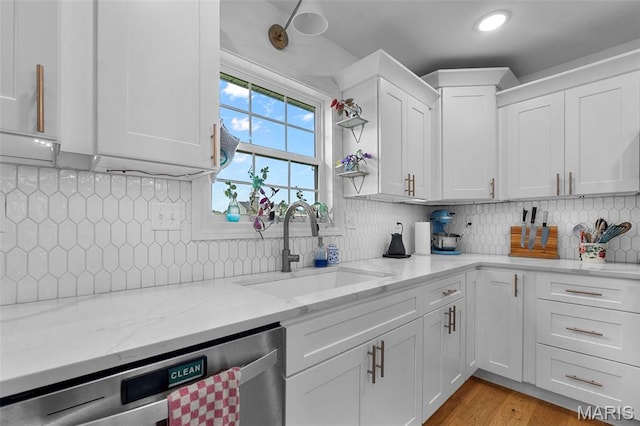 236 Haydens Trl, Jackson, MO 63755 - kitchen featuring dishwasher, white cabinetry, decorative backsplash, light stone countertops, and light wood-style flooring