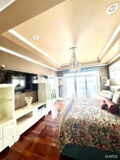 807B Wind Rivers Dr, Grafton, IL 62037 - bedroom featuring wood finished floors, a tray ceiling, recessed lighting, a chandelier, and ornamental molding