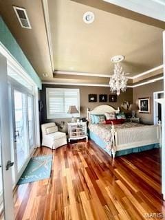 807B Wind Rivers Dr, Grafton, IL 62037 - bedroom featuring wood finished floors, crown molding, a tray ceiling, and a chandelier