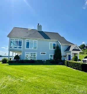 807B Wind Rivers Dr, Grafton, IL 62037 - back of property featuring a yard and a chimney