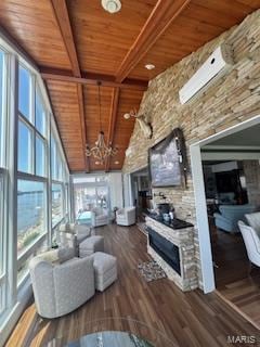 807B Wind Rivers Dr, Grafton, IL 62037 - living room with a wooden ceiling with exposed beams, high vaulted ceiling, a fireplace, wood finished floors, and a chandelier