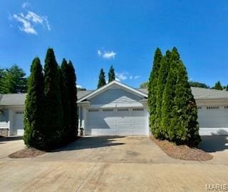 807B Wind Rivers Dr, Grafton, IL 62037 - view of front of home with concrete driveway and a garage