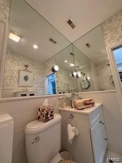807B Wind Rivers Dr, Grafton, IL 62037 - bathroom with tile walls, lofted ceiling, and vanity
