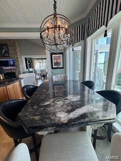 807B Wind Rivers Dr, Grafton, IL 62037 - dining area with a chandelier, ornamental molding, and a fireplace
