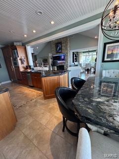 807B Wind Rivers Dr, Grafton, IL 62037 - bar area featuring light tile patterned floors, vaulted ceiling, and recessed lighting