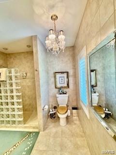 807B Wind Rivers Dr, Grafton, IL 62037 - full bath featuring a tile shower, tile patterned floors, and a chandelier