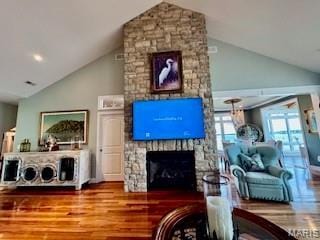 807B Wind Rivers Dr, Grafton, IL 62037 - living room with wood finished floors, high vaulted ceiling, and a fireplace