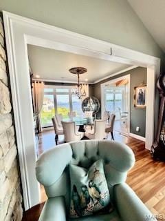 807B Wind Rivers Dr, Grafton, IL 62037 - living area with wood finished floors, a chandelier, and lofted ceiling