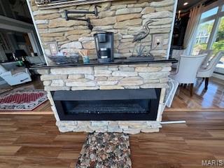 807B Wind Rivers Dr, Grafton, IL 62037 - detailed view of a stone fireplace and wood finished floors