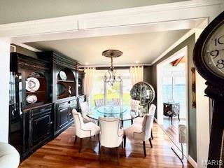 807B Wind Rivers Dr, Grafton, IL 62037 - dining room with wood finished floors, a chandelier, and crown molding