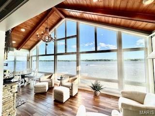 807B Wind Rivers Dr, Grafton, IL 62037 - sunroom / solarium featuring a chandelier and a water view