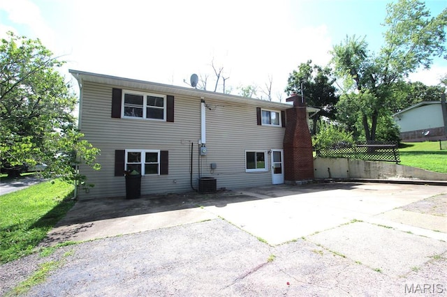 420 Lake Dr, Bonne Terre, MO 63628 - back of house featuring a chimney and a patio