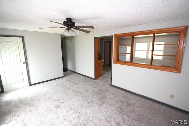 420 Lake Dr, Bonne Terre, MO 63628 - unfurnished bedroom with carpet flooring, a textured ceiling, and ceiling fan