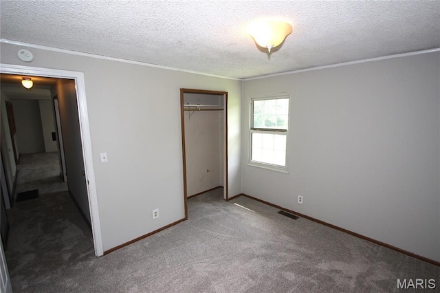 420 Lake Dr, Bonne Terre, MO 63628 - unfurnished bedroom with a closet, carpet floors, a textured ceiling, and ornamental molding