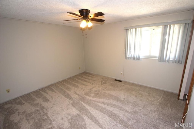 420 Lake Dr, Bonne Terre, MO 63628 - unfurnished room featuring carpet flooring, a ceiling fan, and a textured ceiling