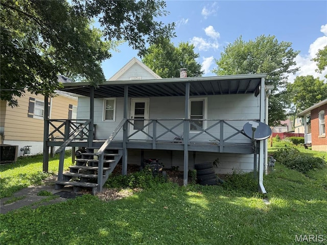 3313 Saint Charles St, Hannibal, MO 63401 - back of property with a lawn, a porch, and stairs