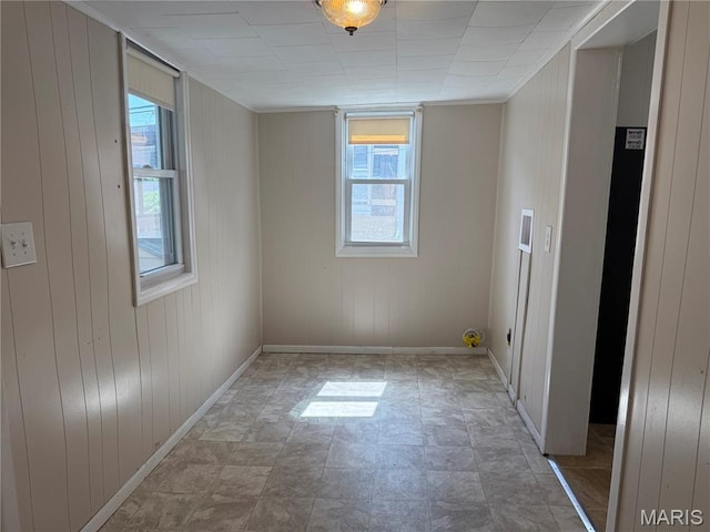 3313 Saint Charles St, Hannibal, MO 63401 - unfurnished room featuring wood walls and baseboards