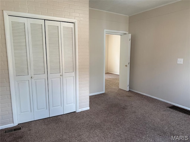 3313 Saint Charles St, Hannibal, MO 63401 - unfurnished bedroom with carpet floors, a closet, and crown molding