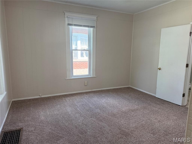 3313 Saint Charles St, Hannibal, MO 63401 - unfurnished room with crown molding, carpet flooring, and healthy amount of natural light