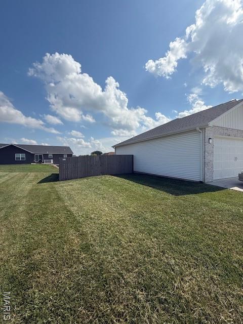 2519 Cortland Dr, Jackson, MO 63755 - view of yard featuring an attached garage