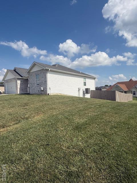 2519 Cortland Dr, Jackson, MO 63755 - view of home's exterior with an attached garage and brick siding