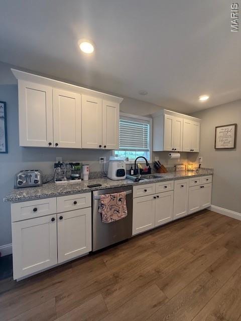 2519 Cortland Dr, Jackson, MO 63755 - kitchen with stainless steel dishwasher, dark wood-type flooring, white cabinets, light stone countertops, and recessed lighting