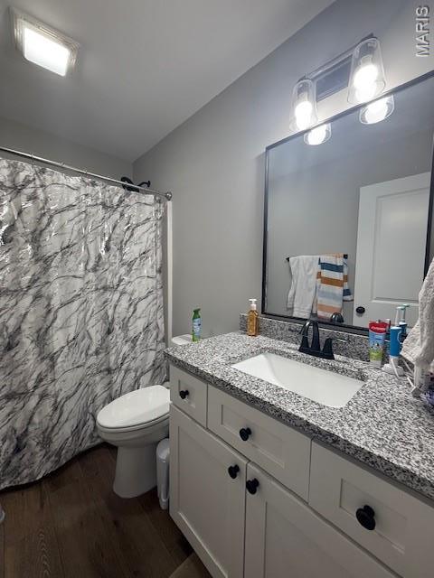 2519 Cortland Dr, Jackson, MO 63755 - bathroom with wood finished floors, vanity, and curtained shower