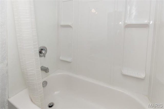 711 Erskine Ave, Lemay Township, MO 63125 - bathroom featuring shower / bath combination with curtain