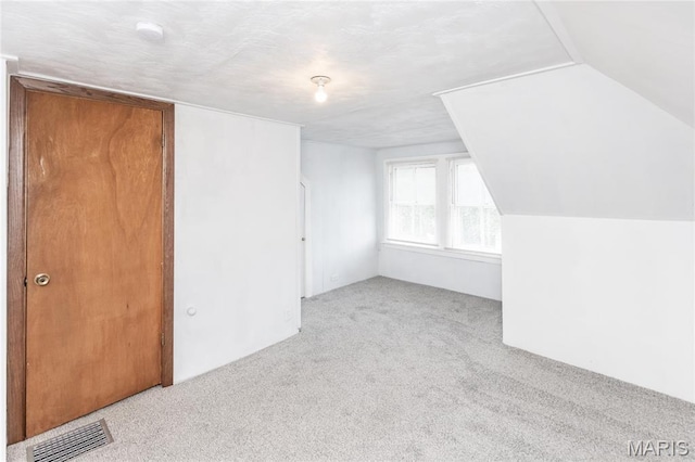 711 Erskine Ave, Lemay Township, MO 63125 - additional living space featuring carpet and lofted ceiling